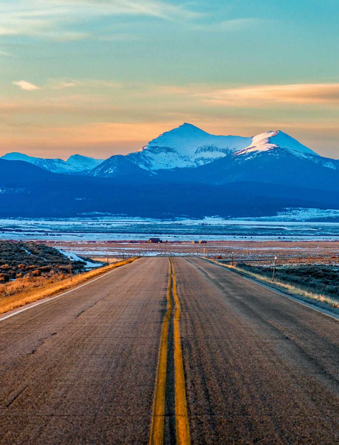road leading off to a mountain in the distance